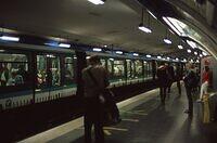 Alesia station - Paris Metro (note "open gangway"-style train, without dividers between cars)